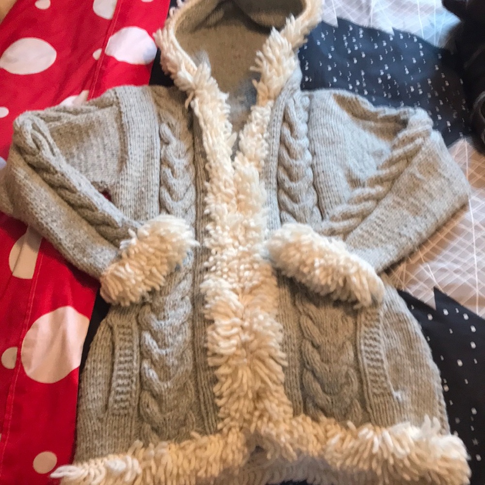 Never worn handmade coat grey and cream size is close to a medium